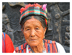 an igorot woman looks on