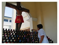 lighting a candle for Jesus to grant her prayers